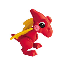 Child's red plastic pterodactyl figure with yellow wings and large black and white eyes.