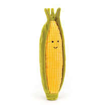 A plush toy resembling a cob of sweetcorn with sunshine-yellow kernels and a stretchy green husk.