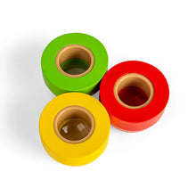 A green, red and yellow round kaleidoscope eye pieces on a white background