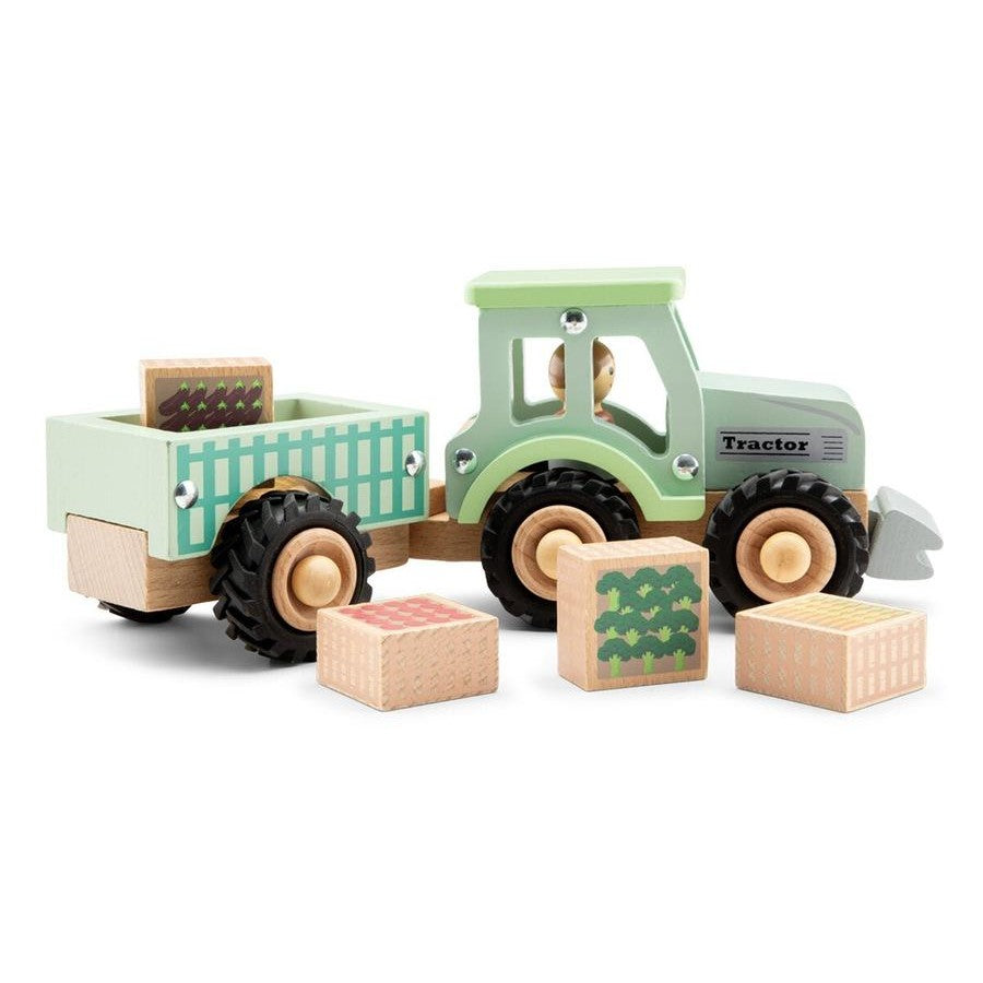 Wooden toy tractor with a green cabin and brown wheels, surrounded by blocks on a white background.