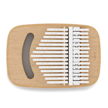 A Strumba Kalimba, also known as a thumb piano, with metal keys on a wooden body.