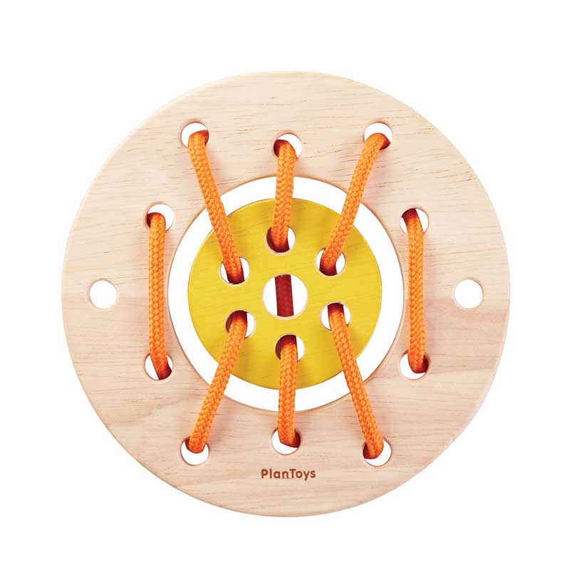 A wooden lacing ring toy with orange laces and a yellow inner circle, designed for kids to develop motor skills.
