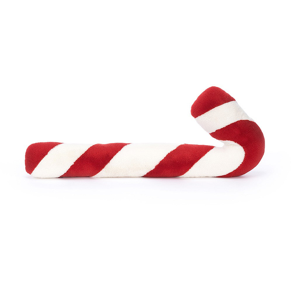 A red and white stripe soft toy resembling a candy cane, on a white background.