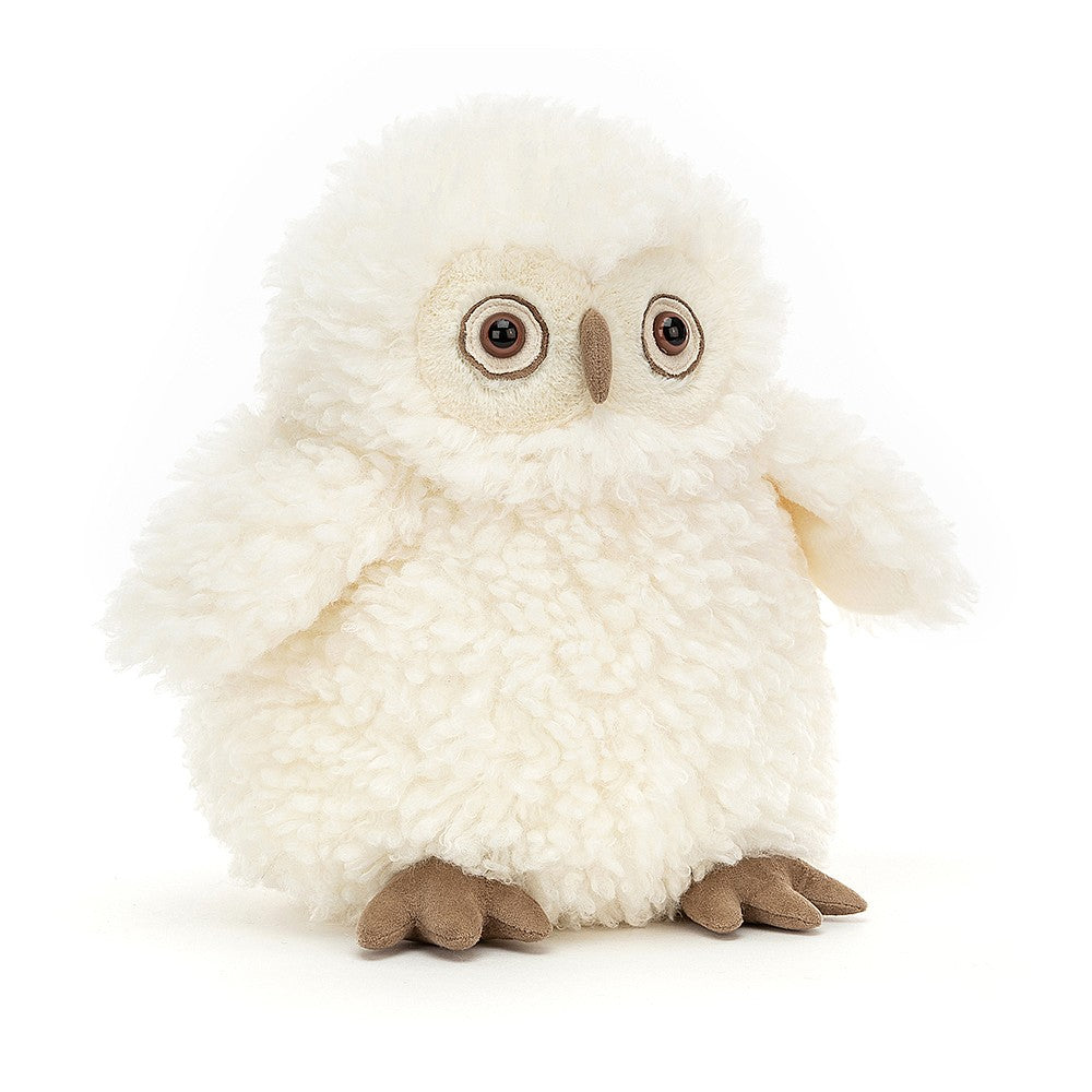 A plush toy resembling a white owl with fuzzy details, featuring bright eyes, a beak, and feet.