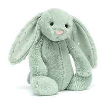 A medium-sized green plush toy rabbit with stars on its ears.