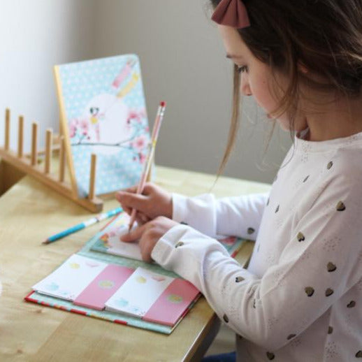 Child using  Misa letter writing set stationery -  Djeco 