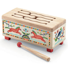 A wooden drum with colorful bird and horse illustrations, accompanied by a wooden drumstick. Designed for young children.