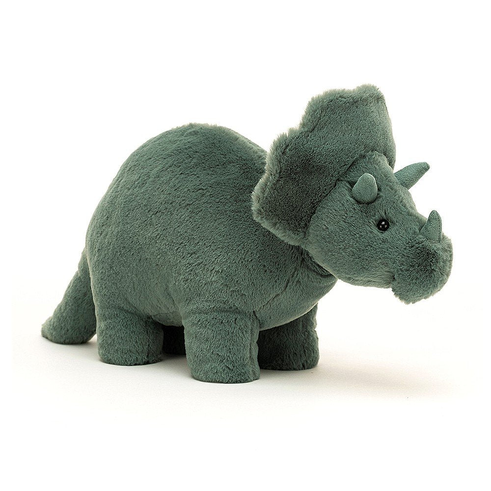 A soft teal green plush toy resembling a Triceratops dinosaur with three suede horns and a neck frill.