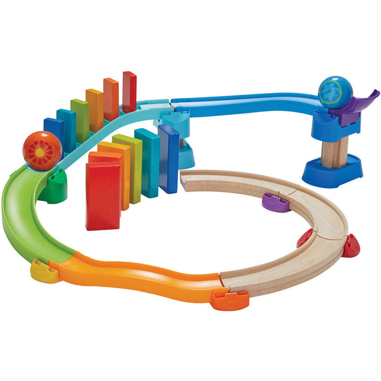 Spiral Domino Ball Track system with rainbow coloured track pieces and domino blocks - Haba - Send A Toy