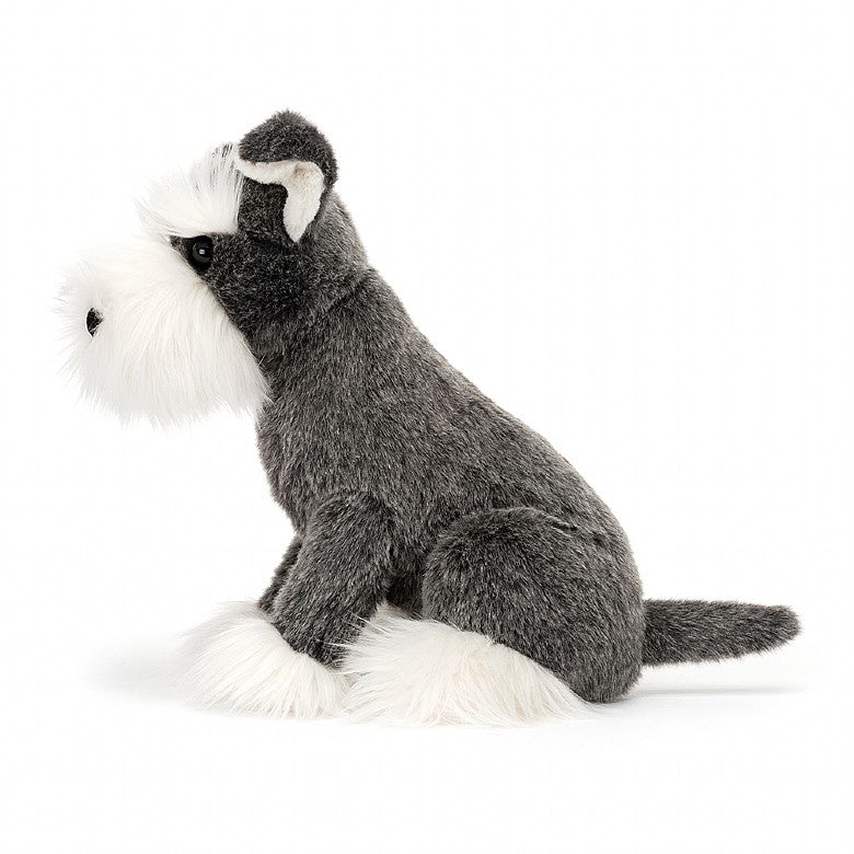 A plush toy resembling a Schnauzer dog with grey and white fur, big ears.