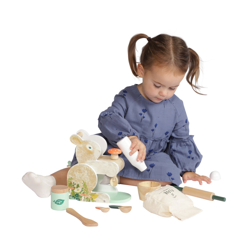 Young girl playing with Bunny Hop wooden Mixer play set