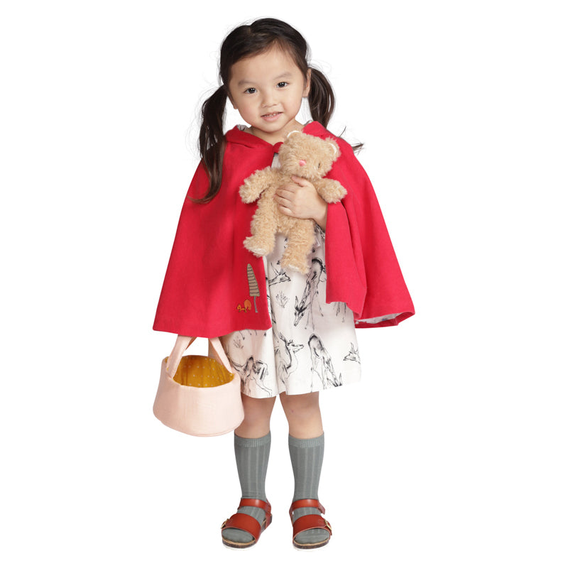 Girl wearing red cape holding Moppettes Bea Bear Set 