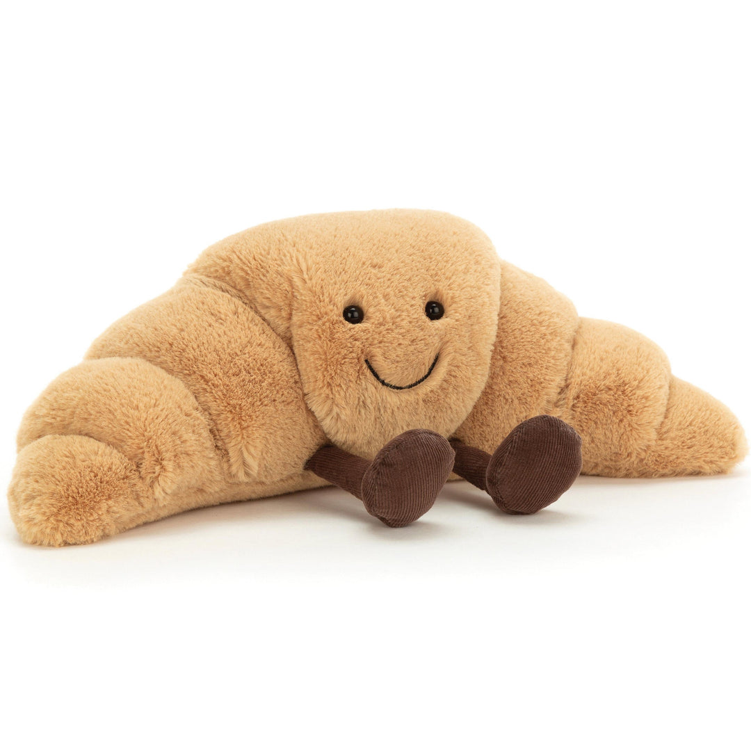 Amuseable toffee brown Croissant Jellycat soft toy with big smile and brown corduroy legs - at Send A Toy