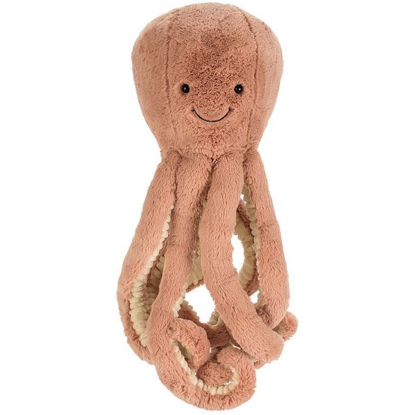A large brick coloured soft toy with smiling face, resembling an octopus.