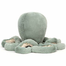 A large sea moss green plush resembling an octopus toy with  long curly tentacle arms.
