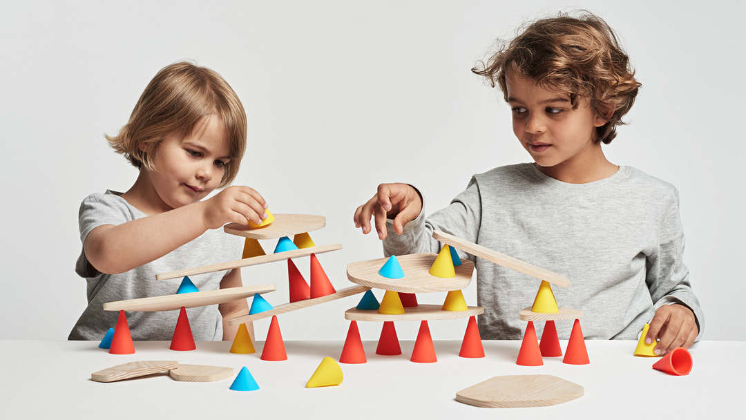 Children playing with piks 44-piece silicone and wood construction set