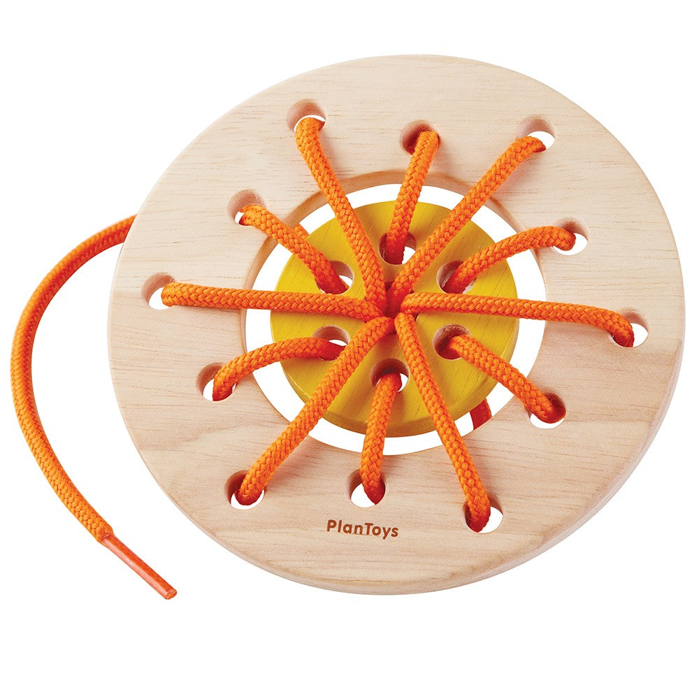 Round wooden two disc Lacing Ring by Plan Toys - Lace and Thread Toy